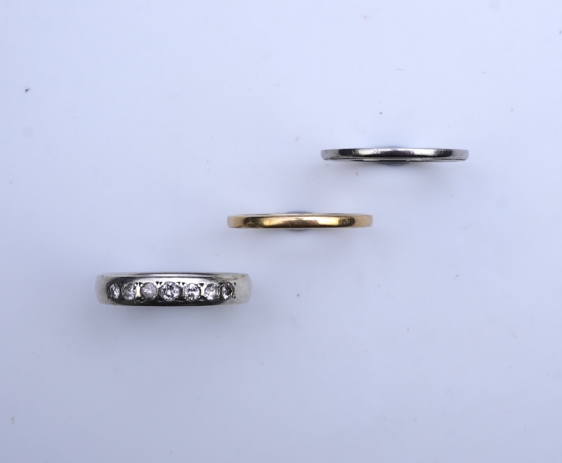 A diamond ring and two gold wedding rings